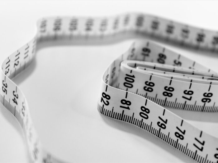 selective focus photography of tape measure