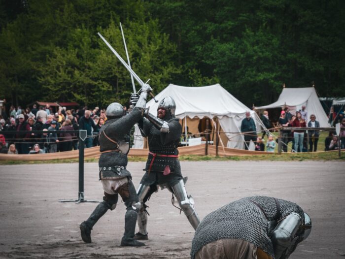 men fighting with sword